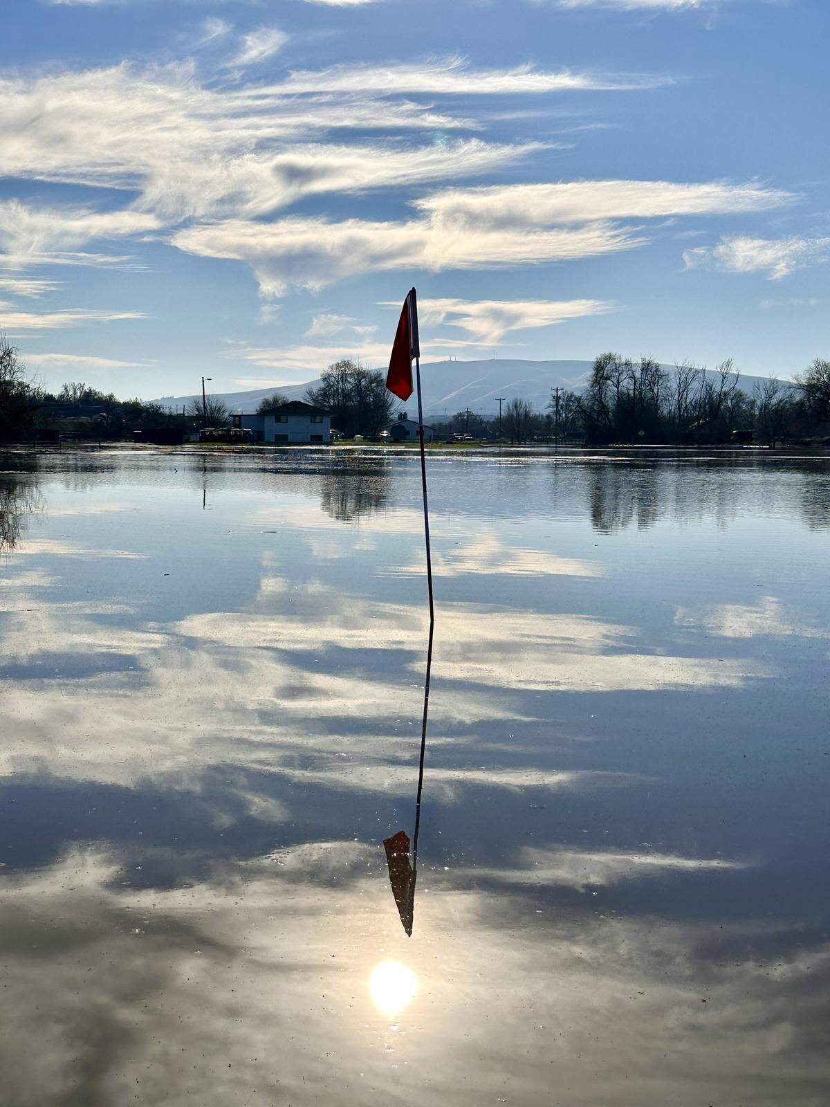 The No. 2 hole at the Buckskin Golf Club in West Richland was underwater Saturday morning.