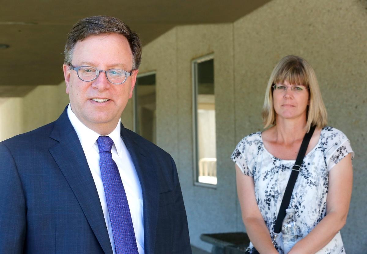 PNNL manager Aleta Busselman, right, stands with her attorney Jack Sheridan outside the Federal Building in Richland after a news conference.