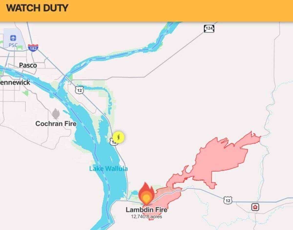 A wildfire that’s threatened homes and burned about 1,800 acres was continuing Tuesday to rage between Wallula Gap and Touchet.