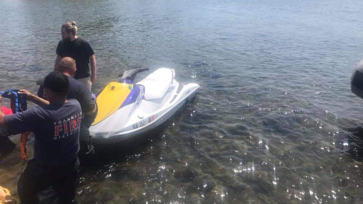 Two people were riding on a personal watercraft Saturday afternoon when they hit shallow water.