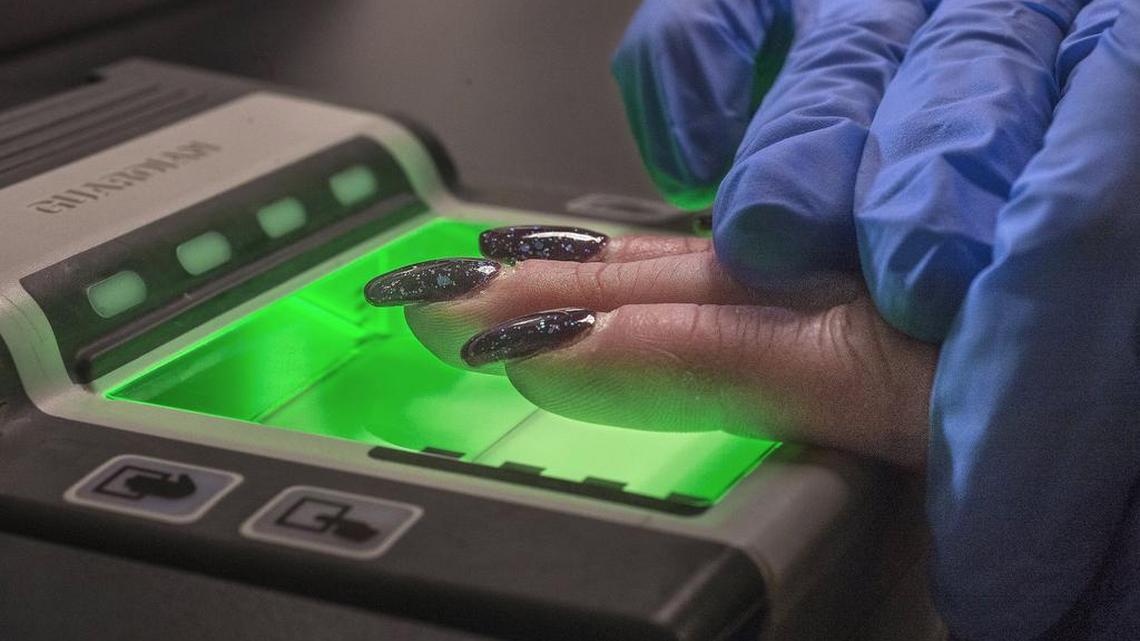 Fingerprints are scanned electronically at the Washington State Patrol’s Criminal Records Division in Olympia. Those fingerprint records, requested by government and private entities across the state, are used to do criminal background checks.