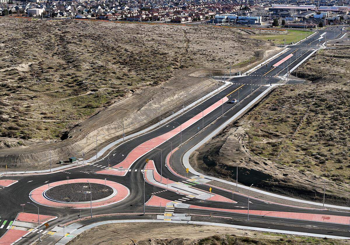 The recently paved section of Sandifur Parkway connects to Road 108 at a roundabout in west Pasco near the I-182 Road 100 interchange.