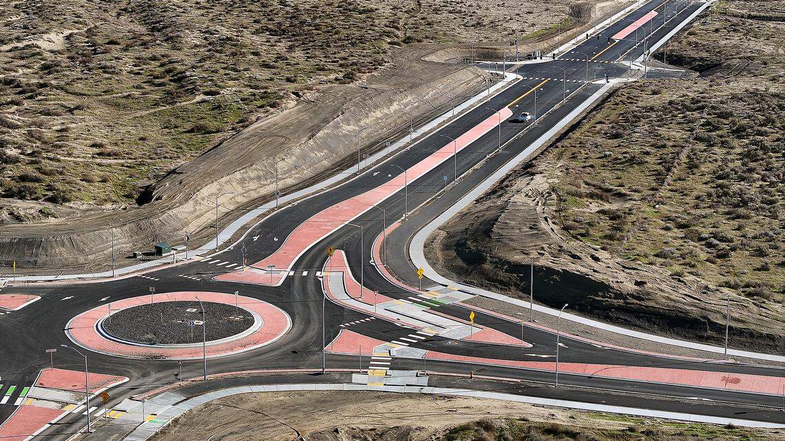 The recently paved section of Sandifur Parkway connects to Road 108 at a roundabout in west Pasco near the I-182 Road 100 interchange.