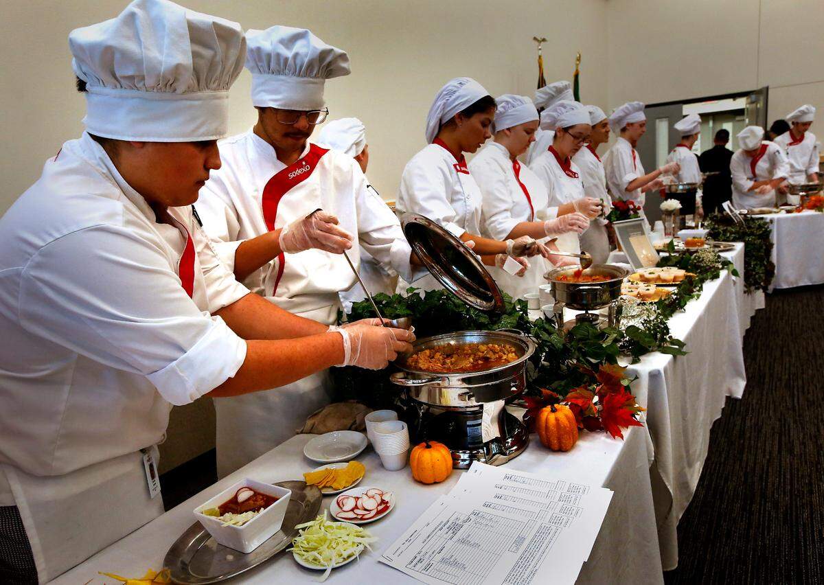 Team Atec members Daniel Juarez of Kiona-Benton High School and Jose Luis Alcantar of Southridge High School, from left, prepare to serve their Pozolé soup to the judges at the annual fall soup competition at Tri-Tech Skills Center in Kennewick. Community member judges were asked to rank and provide feedback to the young chefs in-training during the event. About 30 area students from area high schools took part in the morning session of the competition. About 30 area students from area high schools took part in the morning session of the competition organized by instruction Luanne Wiles.