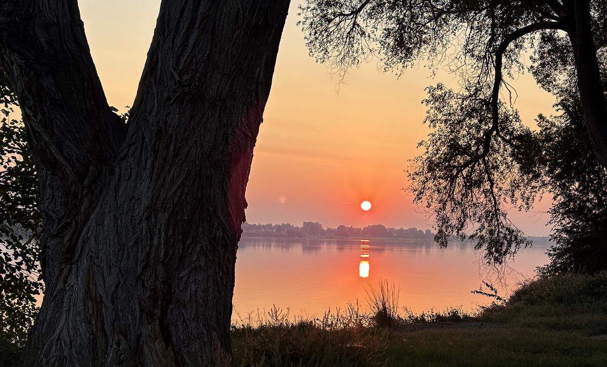 The smoky skies have made for dramatic sunrises this week as seen from Columbia Park in Kennewick.