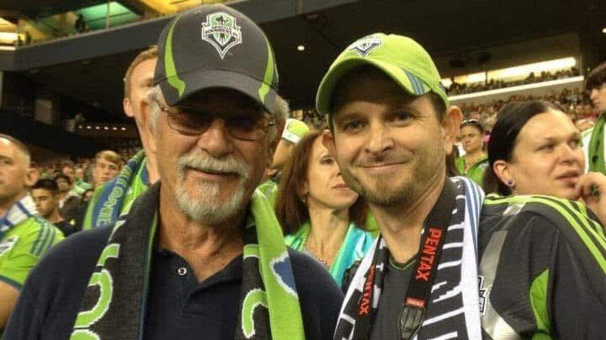 Todd Kleppin, right, and his father at a Seattle Sounders match.
