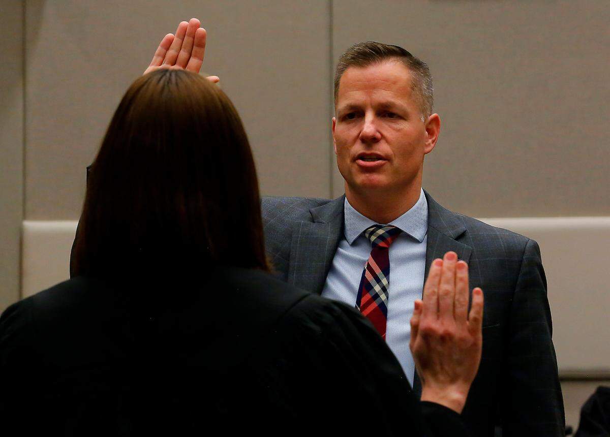 Eric Eisinger is sworn in as the new Benton County Prosecutor, the first one since 1986, by Judge Diana Ruff during a ceremony at the Benton County Justice Center in Kennewick.