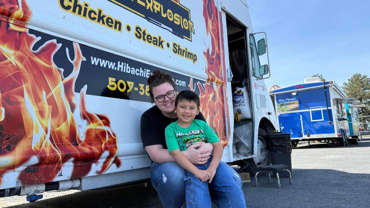 Gabrielle Cerdio and her son, Colter, 5, pose in front of Hibachi Explosion, a Kennewick food truck. Immigration officials took her husband, Sergio Cerdio Garcia, into custody during a scheduled interview in Yakima.