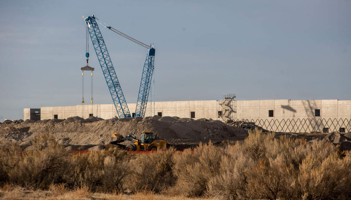 The walls are going up on Amazon’s two warehouses, each 1 million square feet, in east Pasco. The $200 million distribution warehouses will be among the largest in North America when finished next fall and will employ about 1,500 people.