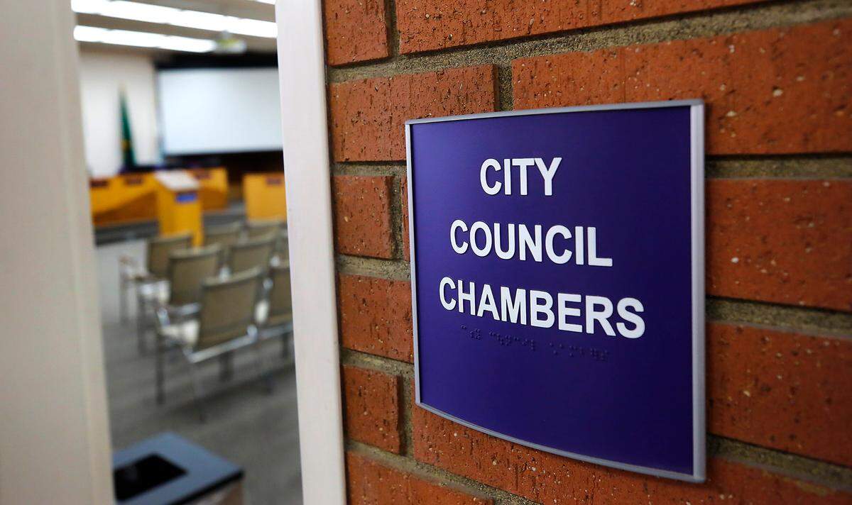 Sign in hallway to the city council chambers at Kennewick City Hall in downtown Kennewick.