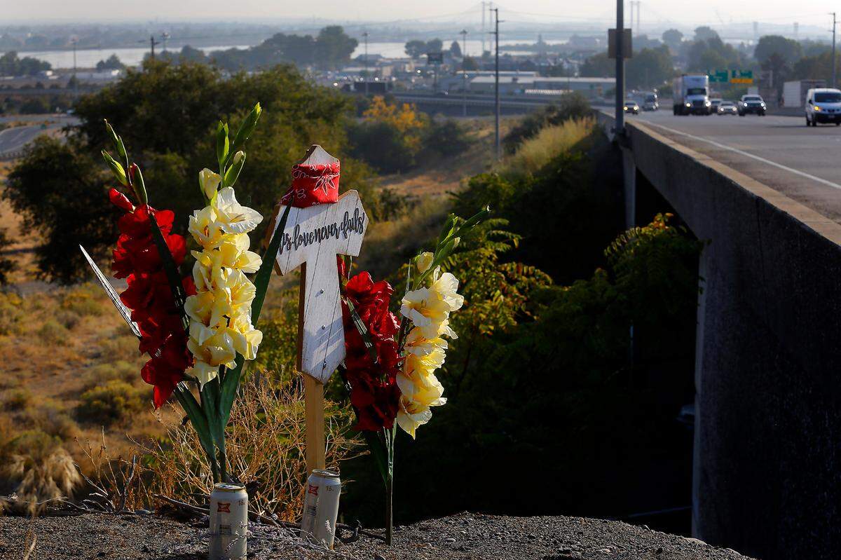 Roadside memorial placed near where a Kennewick man was killed when a semi truck slammed into his car after he stopped because of another crash on Highway 395 in Kennewick in October 2022.