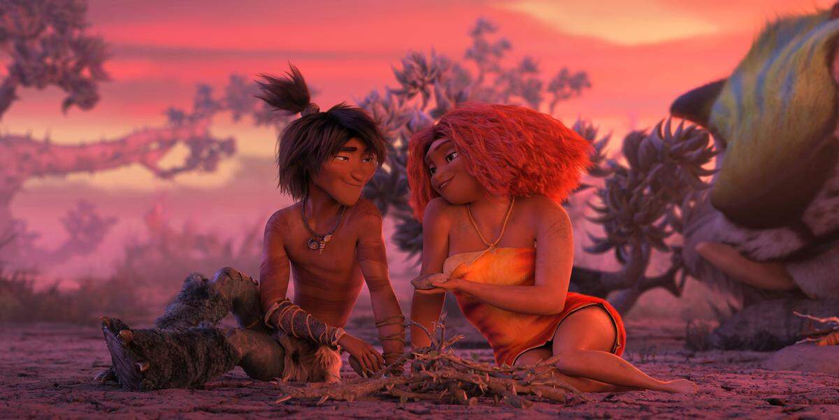 This image released by DreamWorks shows Guy, voiced by Ryan Reynolds, left, and Eep Crood, voiced by Emma Stone, in a scene from the animated film “The Croods: A New Age.”