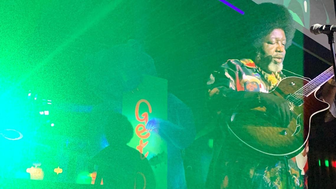 Afroman plays a guitar, borrowed from reggae band Naughty Pine, during his set on the Uptown Get Down Main Stage, at the Uptown Theatre.