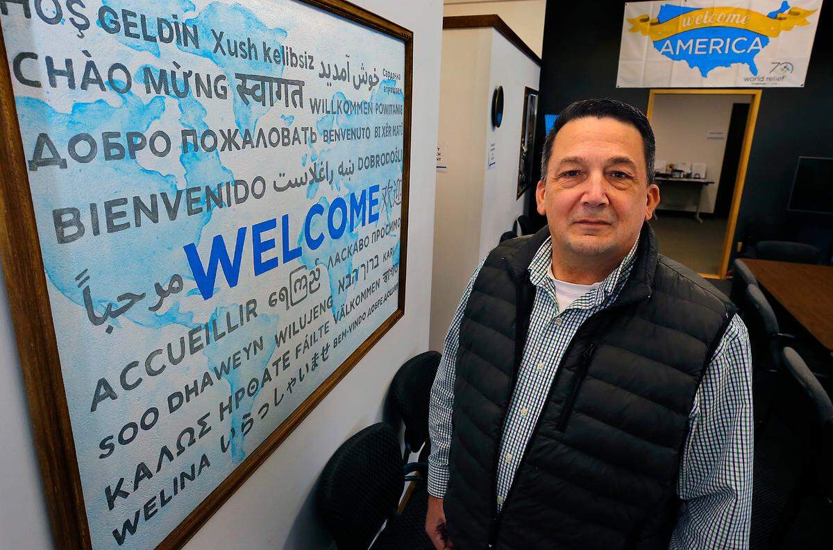 Ken Primus, director of World Relief Tri-Cities, stands in the organization’s Richland offices. It’s Southeast Washington’s only refugee resettlement agency, helping hundreds of legal refugees fleeing persecution, war or violence.
