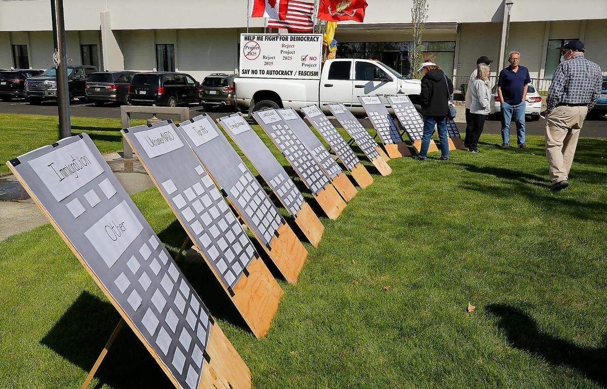 Copies of comment cards to be handed into the Richland office of Rep. Dan Newhouse were displayed at Wednesday’s rally organized by Indivisible Tri-Cities.