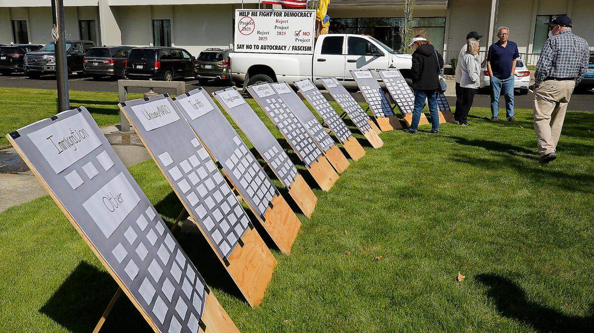 Copies of comment cards to be handed into the Richland office of Rep. Dan Newhouse were displayed at a rally held by Indivisible Tri-Cities.