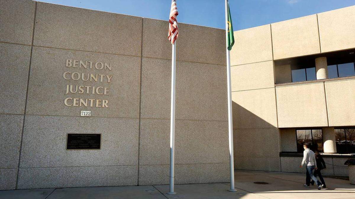 A 22-year-old man is charged with trying to take pictures of a woman while she was shopping for swimsuits at Columbia Center mall in Kennewick.