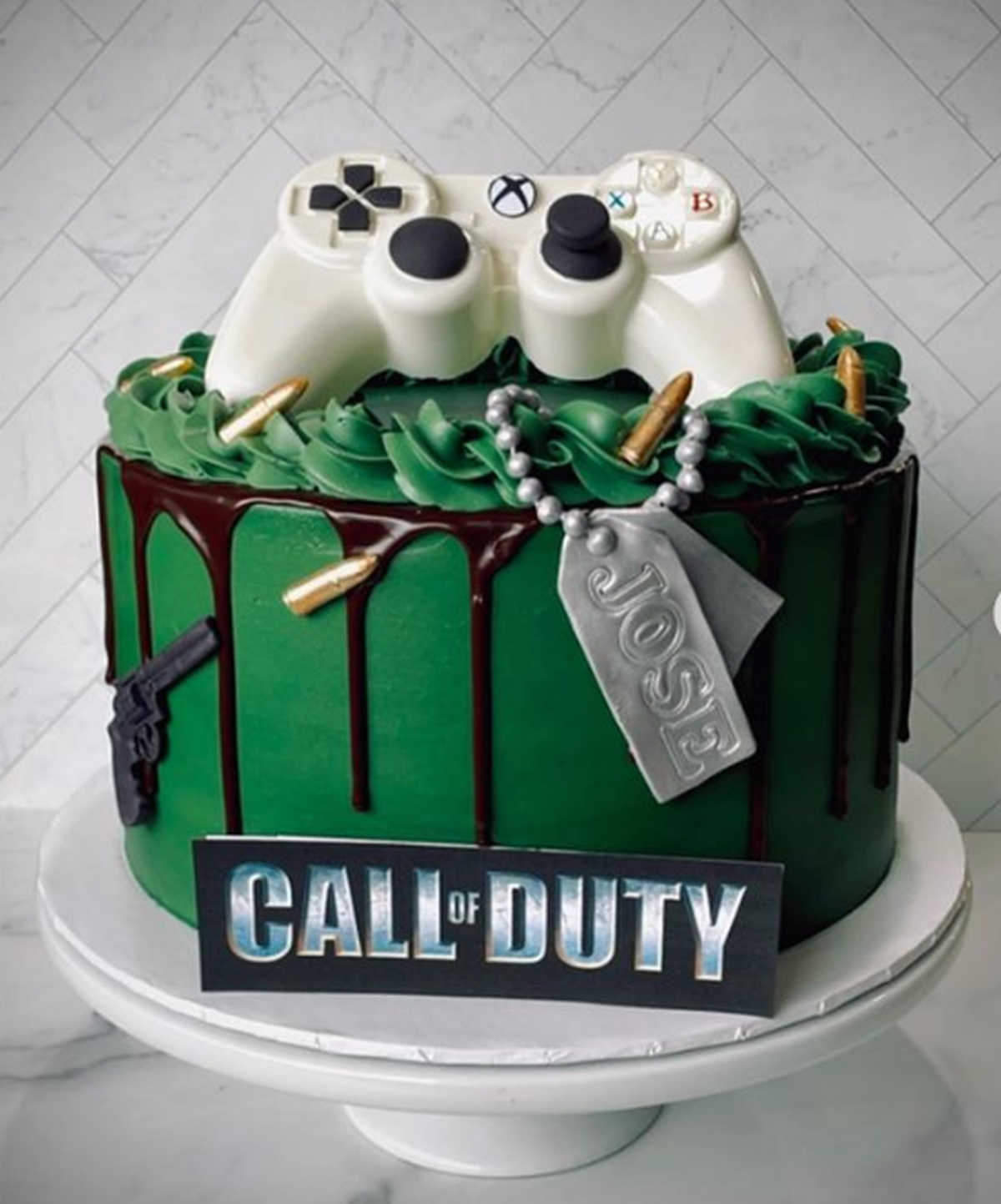 Call of Duty themed coconut cake from Simply Sweetz LLC featuring a white chocolate Xbox controller.