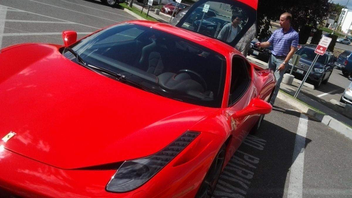 Mark Wondrack shows Fabio Gomez, 14, his Ferrari at Kadlec Regional Medical Center in Richland. (2014 file photo)