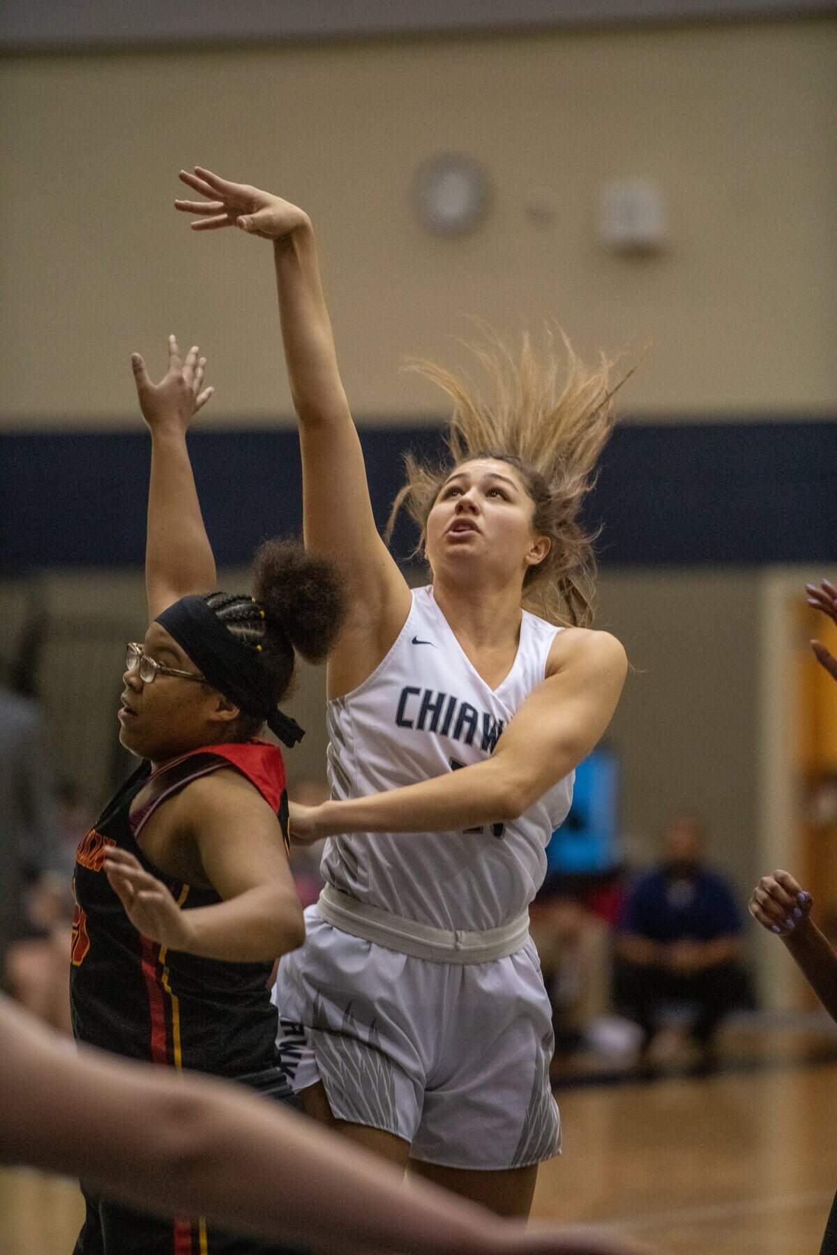 Chiawana 6’1” junior stand-out Talia VonOelhoffen shoots over the top of Kamiakin’s Amani Davis in a recent game.