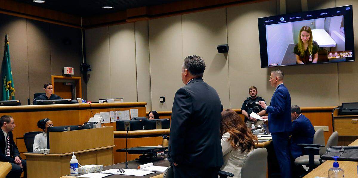 Suspect Sarah Lee Clasen makes her preliminary appearance in Benton County Superior Court via a video link from the Benton County Jail in Kennewick. Her defense attorney Scott Johnson, left and Benton County Prosecutor Eric Eisinger stand before Judge Diana Ruff during the preliminary hearing.