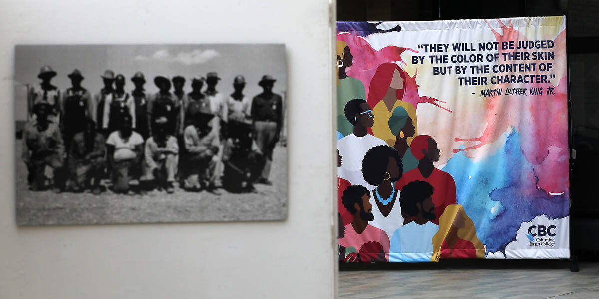 A colorful backdrop and a series of historic Hanford photos are on display in the atrium of the H bulding for the annual Martin Luther King Jr. Bell Ringing Ceremony on the Pasco campus.
