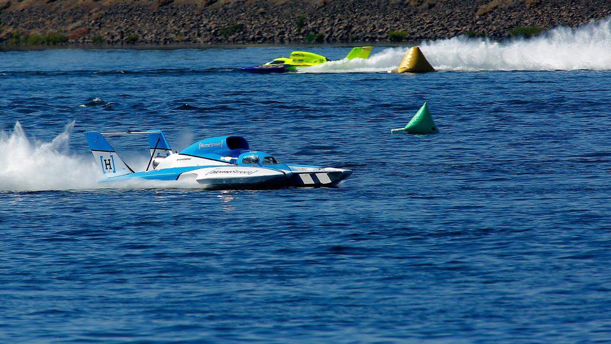 Jimmy Shane races to victory in the U-1 Miss Homestreet unlimited hydroplane in front of second place finisher Jamie Nilsen in Heat-2A of the Columbia Cup in the Tri-Cities.