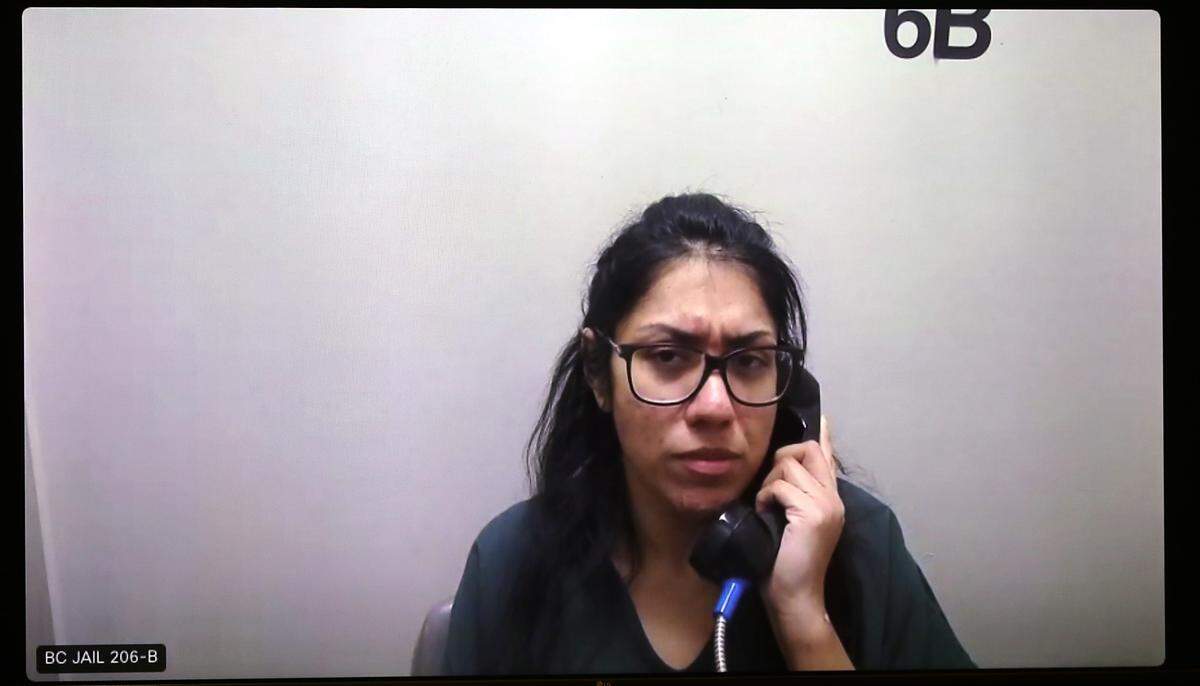 Coral Ochoa Hernandez, 33, appears in Benton County Superior Court Wedenday via a video link from the Benton County Jail. She is the girlfriend of murder suspect Michael Golden and is charged with rendering criminal assistance.