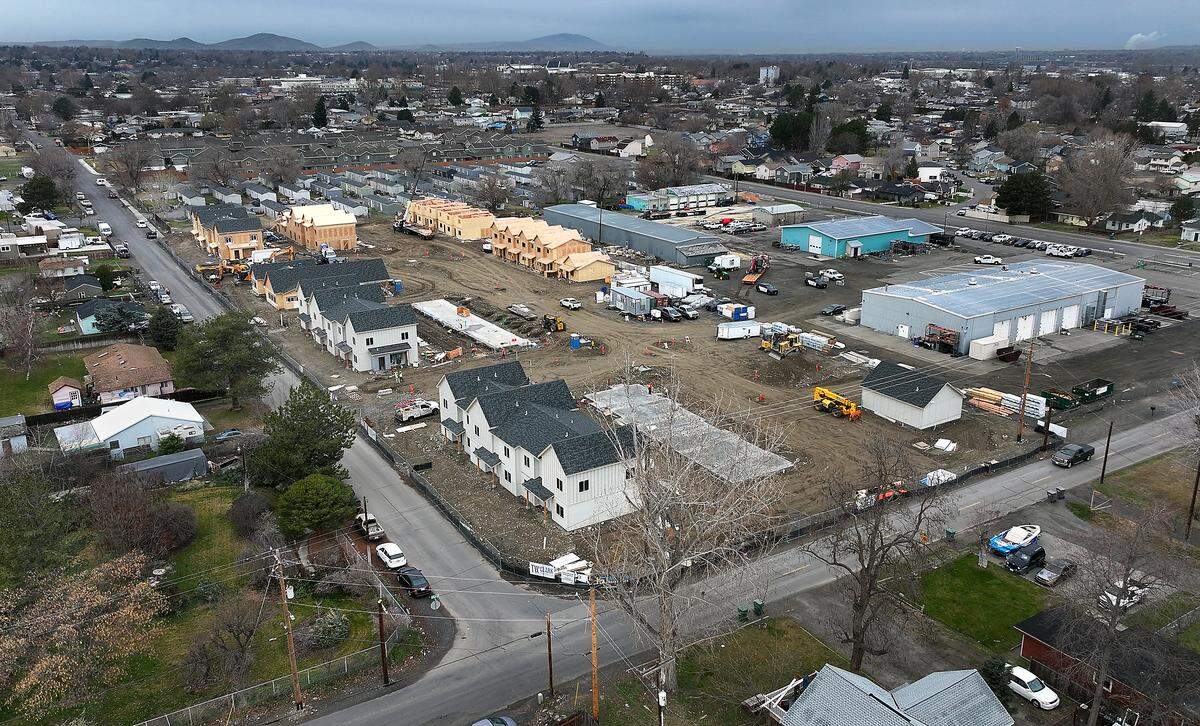 Construction crews works at the new $19 million Sunset Ridge Town Homes project being built by the Kennewick Housing Authority at the corner of East 13th Avenue and South Gum Street.