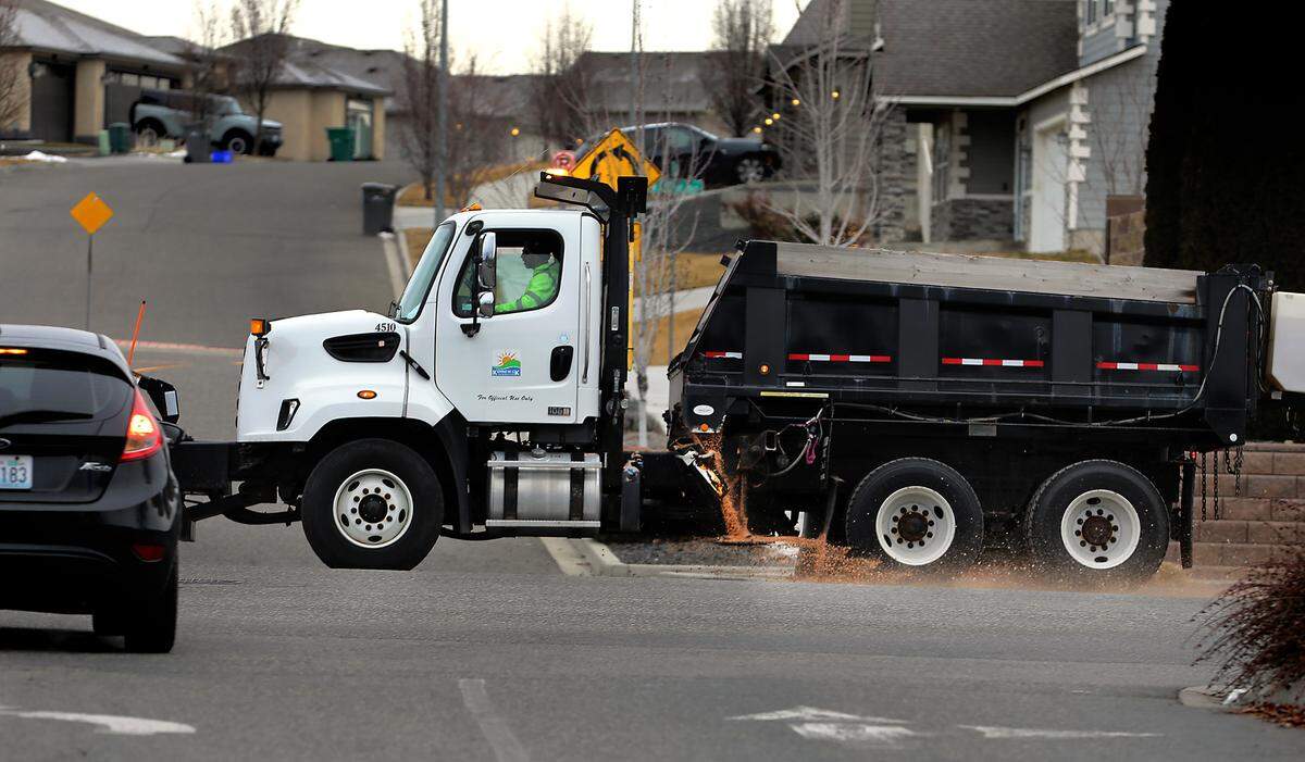 A Kennewick city snowplow spreads a load of salt on Hildebrand Boulevard near South Grant Steet Thursday morning, several hours before predicted snowfall was expexted to start. The Tri-Cities is under a winter weather advisory through Friday afternoon with 2 to 4 inches of snow expected by the National Weather Service.