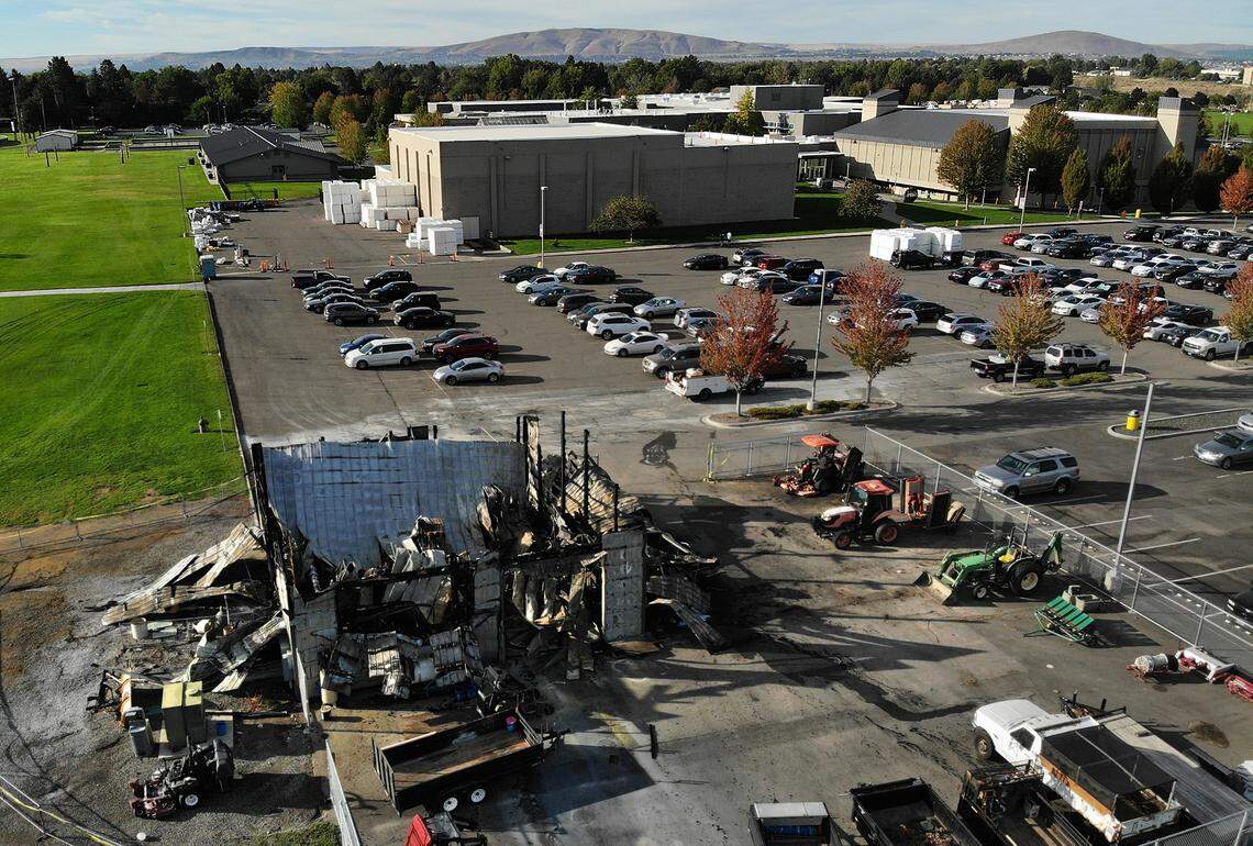 The roof of an equipment shed, filled with irrigation parts and supplies, field painting equipment and supplies, two utility task vehicles and a forklift at Hanford High School collapsed following two fires over the weekend.
