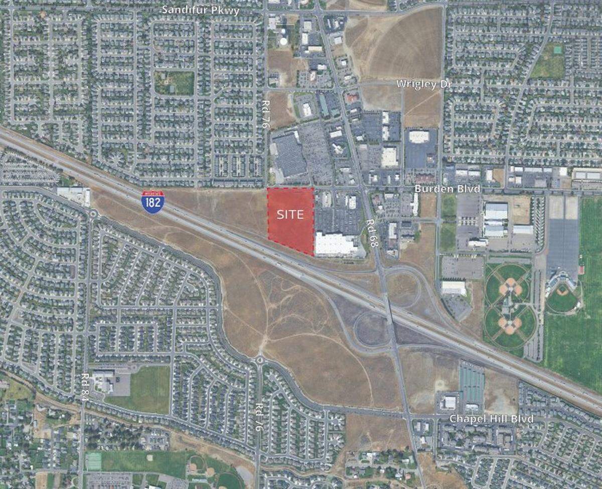 A Seattle developer is proposing an unnamed 128,000-square-foot store with distinctive Target-like features on a 14.5-acre site near Lowe’s Home Improvement and Walmart in western Pasco.
