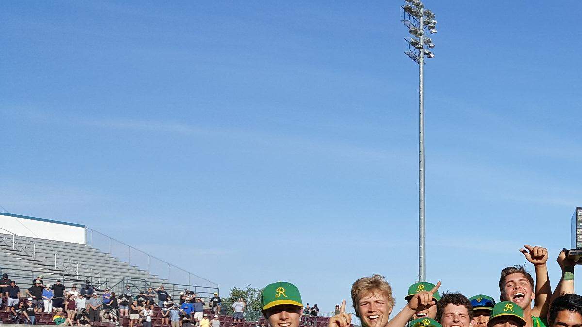 The Richland baseball team celebrates its 5-2 victory over Skyview in Saturday's 4A state championship game at Gesa Stadium in Pasco. Shortstop Adam Weissenfels is holding the trophy.