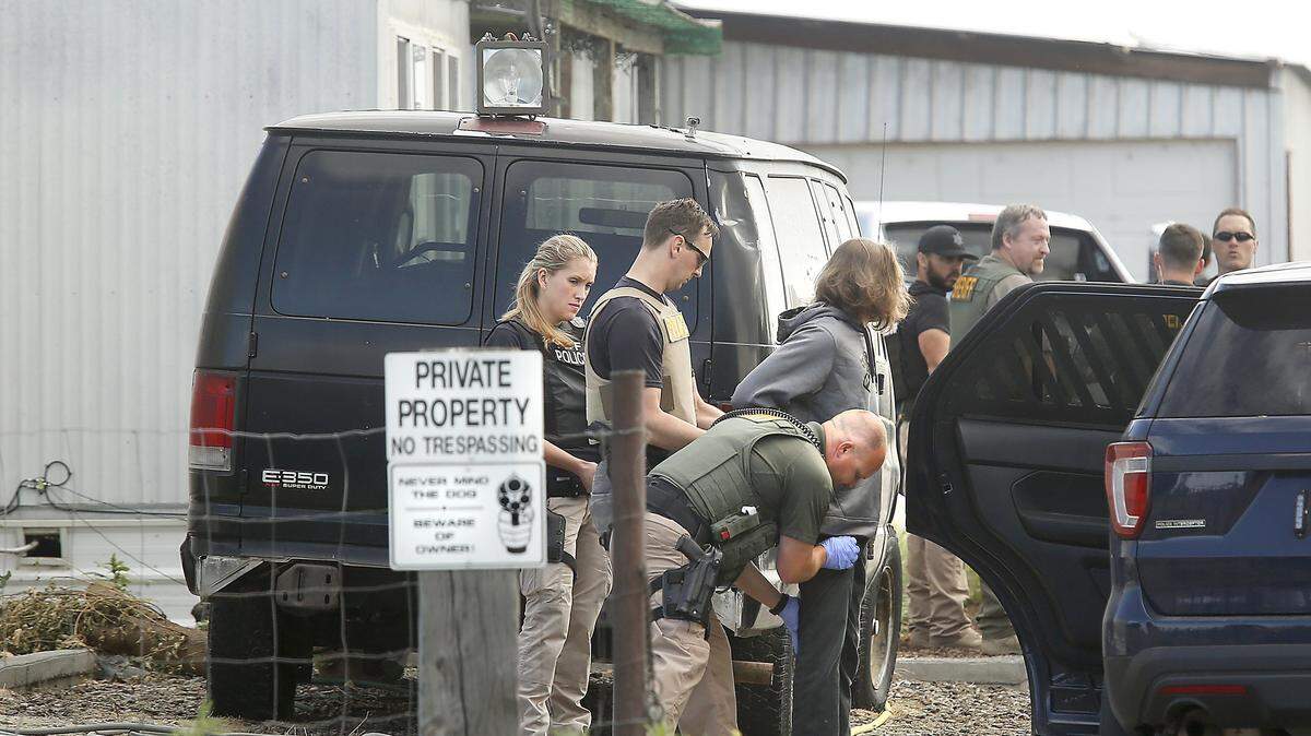 Law enforcement take an unidentified male suspect into custody Wednesday morning at a single-wide mobile home early Wednesday morning at 14904 S 1977 PRSE in Finley. Officials said the activity was related to an ongoing drug investigation involving Fentanyl. Watch a video at: tricityherald.com