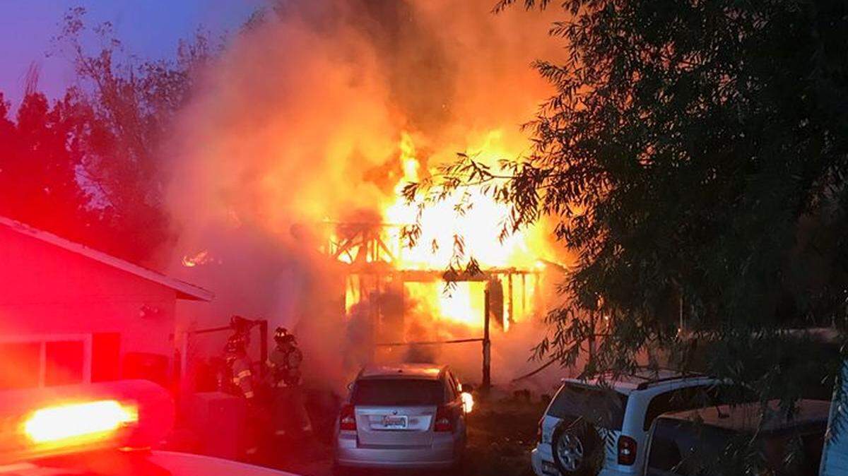 Three people escaped an inferno in a home on North Crosby Road after they woke to smell smoke.