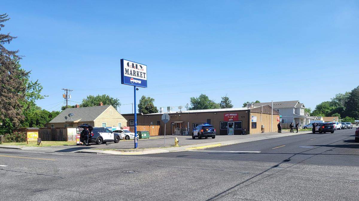 Kennewick police search for a suspect in a shooting near the City Market convenience store on Rainier Street.