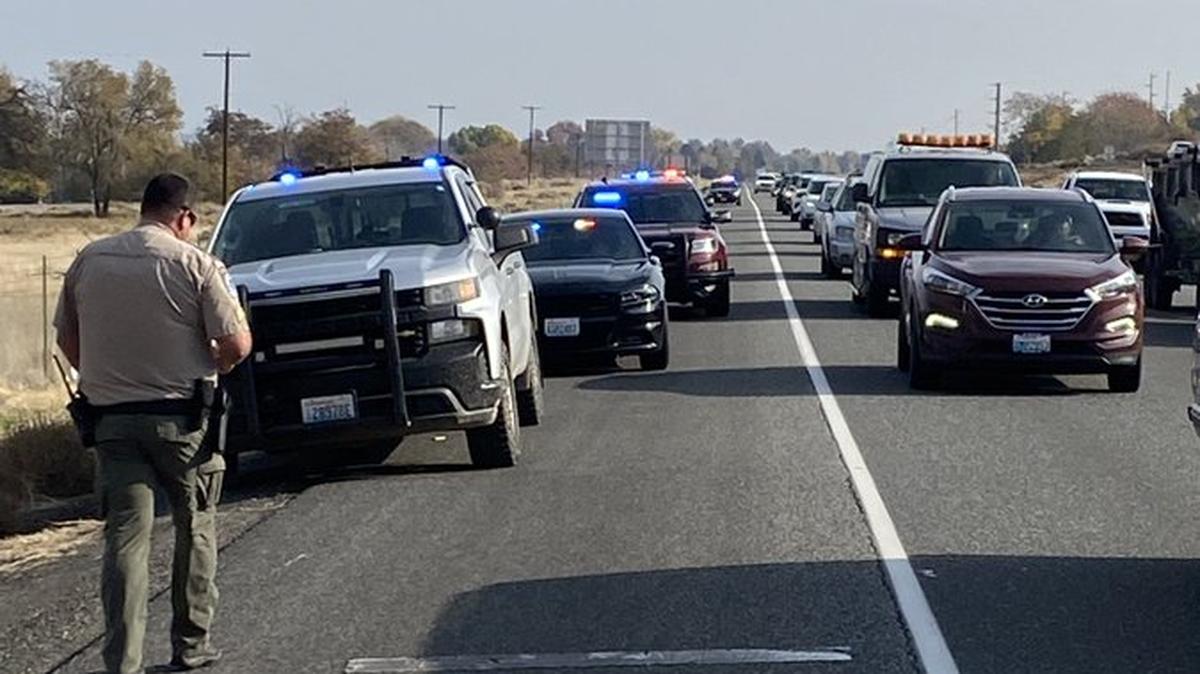 Traffic was backed up on Highway 240 near Columbia Park after a Kennewick man rolled his car into the park Monday. He did not survive.