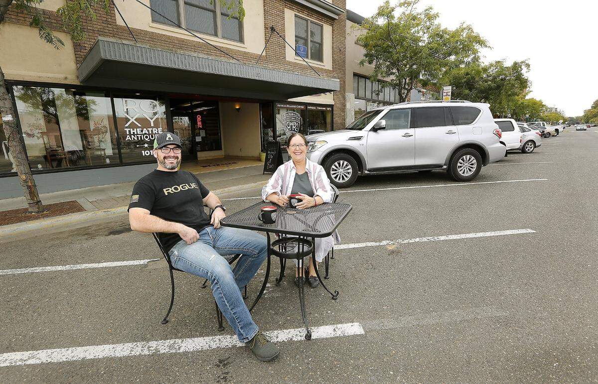 Travis Jordan, left, owner of Rockabilly Roasting Co. and Ann Steiger, owner of the Roxy Theatre Antiques were excited supporters of a “StrEateries” pilot program in 2017.