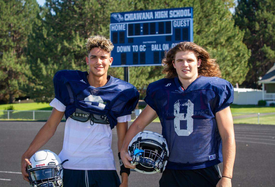 Chiawana’s quarterback JP Zamora (3), left, and Bridger Feldman (8).