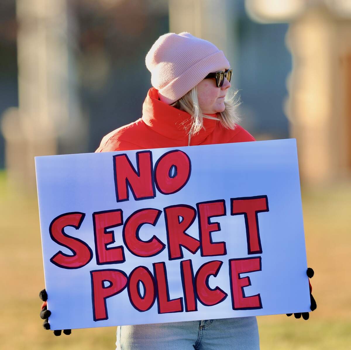 About 120 protesters waved signs at drivers along George Washington Way at John Dam Plaza in Richland on Sunday after the weekend killing of Alex Pretti, a nurse in Minneapolis, by immigration agents.