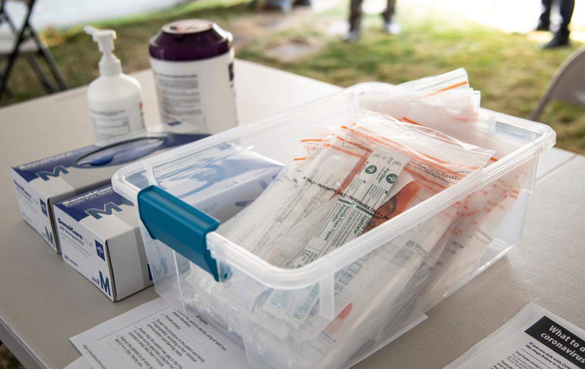 COVID-19 testing kits sit ready for use at a testing tent behind the Kadlec Urgent Care in Kennewick. The testing tent is not open to the general public but is meant for Kadlec patients who are are referred to the clinic by their doctors.