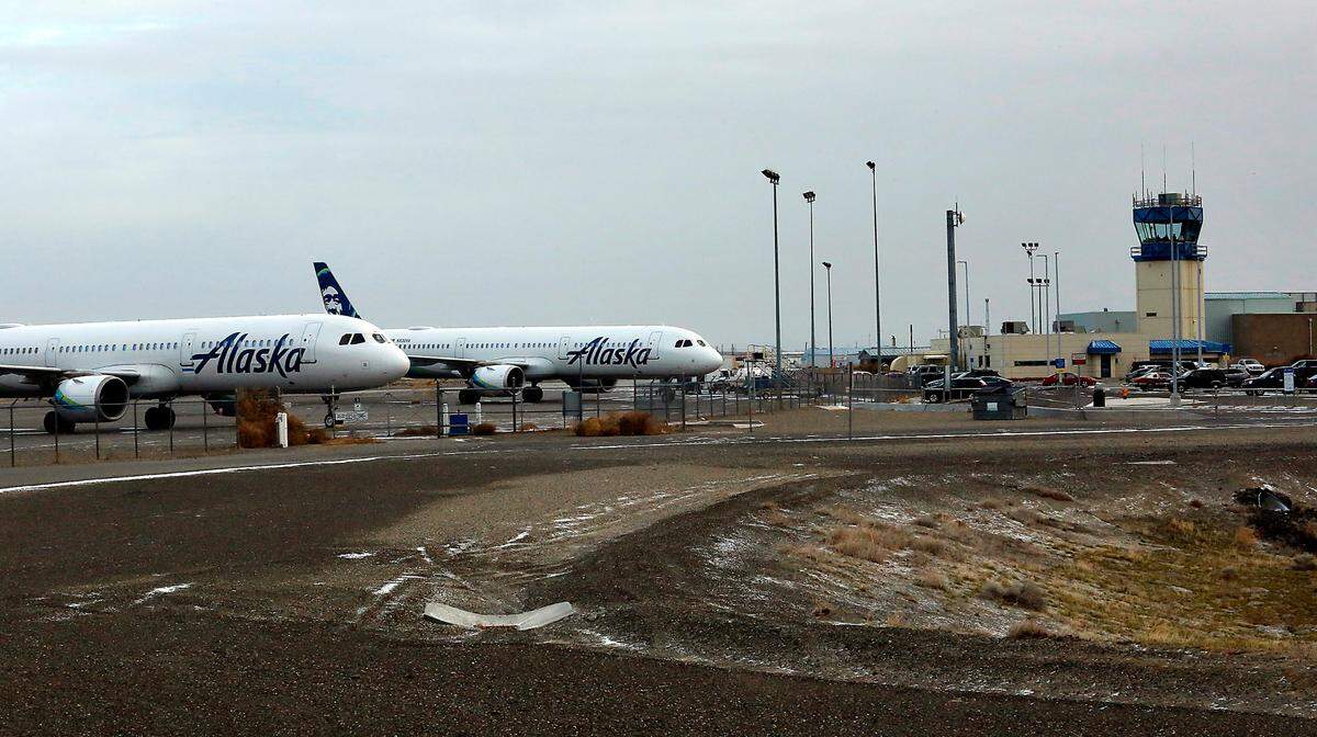 Two Alaska Airlines jet planes sit on the Tri-Cities Airport tarmac Monday morning after being diverted to Pasco Sunday night, according to Tri-Cities Airport Director Buck Taft. The diversions came as the Seattle-Tacoma International Airport was forced to cancel 364 flights because of winter weather.