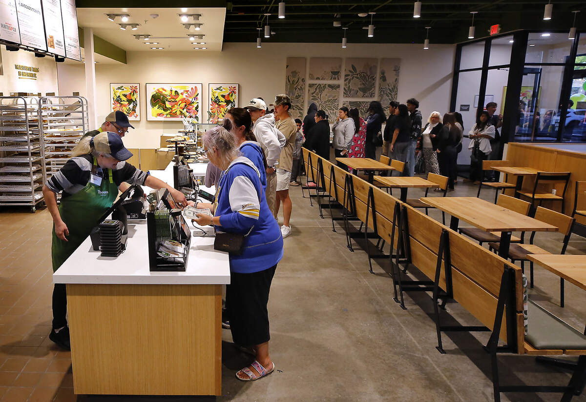 Cindy Wade of Kennewick is the first customer to make a purchase in the newly opened Kennewick Panera Bread restaurant.