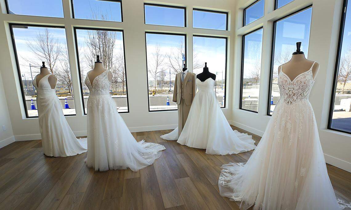 Wedding attire on display for the ribbon cutting ceremony to celebrate the opening of her new store called Blueberry Bridal Boutique. 