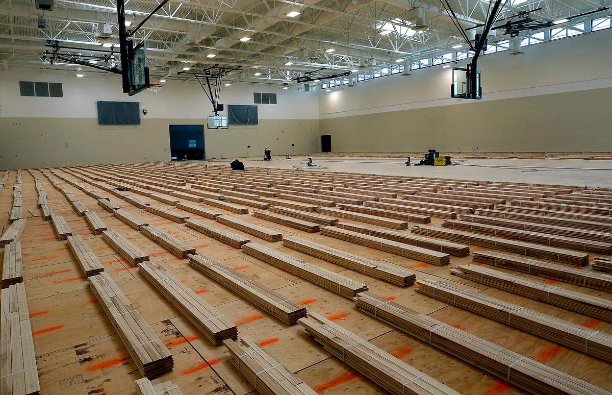 Thousand of boards are ready to be installed on the floor in the gymnasium at Sageview High School in Pasco.