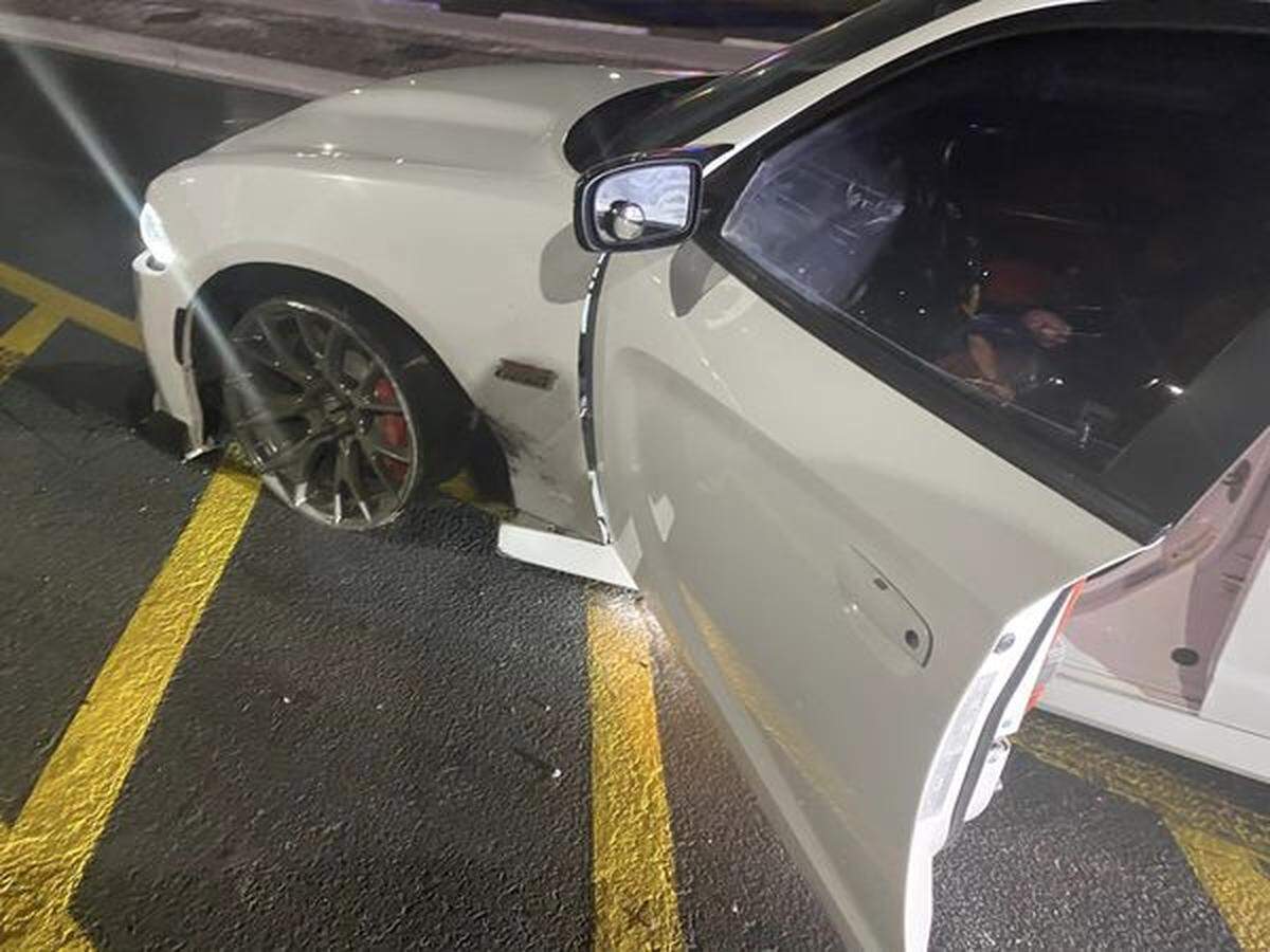 A disabled Dodge Charger was found in the Richland Winco parking lot, after law enforcement deployed spike strips on Interstate 182 but the car sped off.