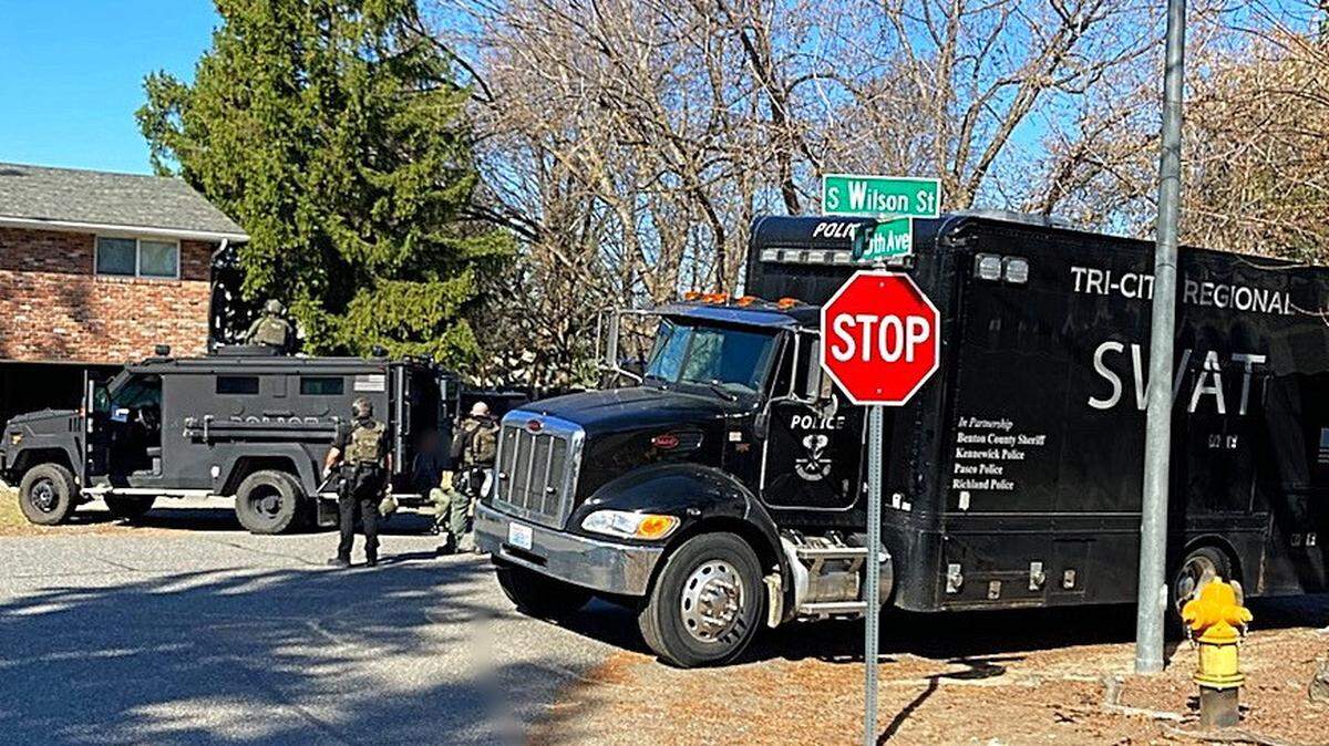 Two people were arrested Tuesday morning by detectives and the Tri-Cities Regional SWAT team in connection with an early morning shooting Saturday.