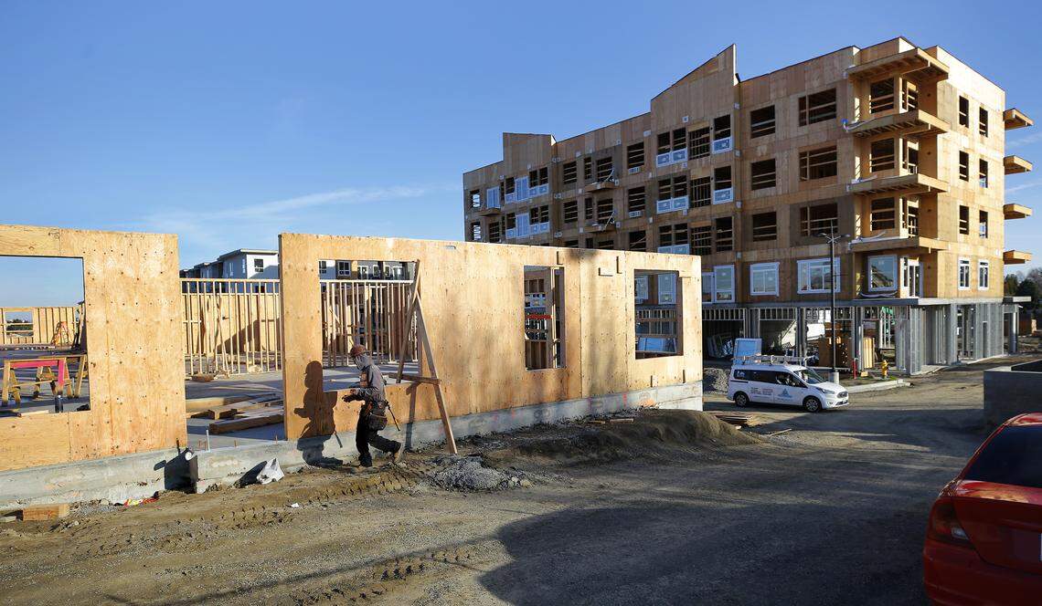 Construction workers are framing and finishing the final phases of the 18-acre Resort at Hansen Park rental community in Kennewick.
