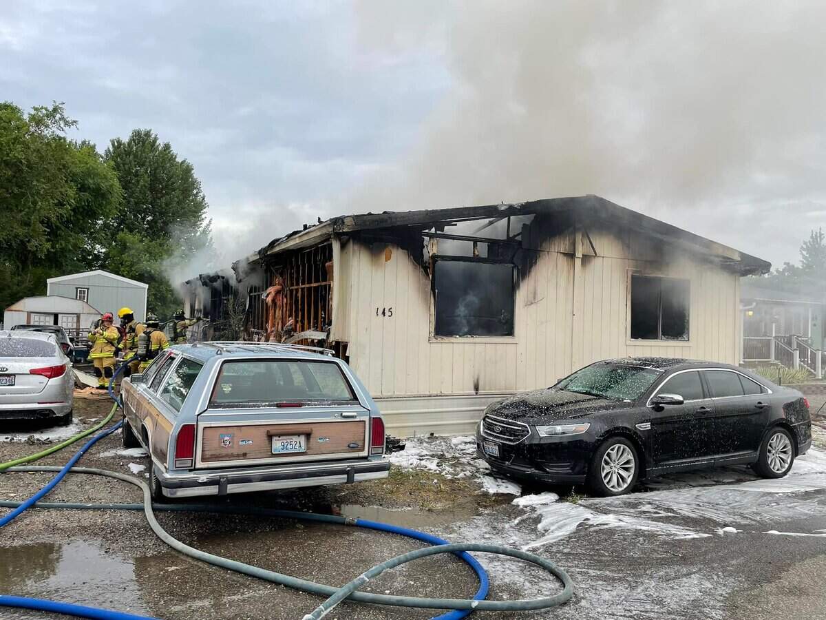 Fire destroyed a manufactured home in West Richland the morning of July 4. Two adults were injured and taken to a hospital.