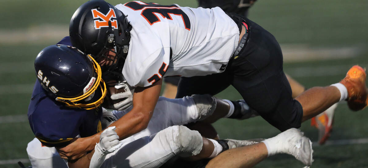 Tanner Larson makes a tackle during Friday Sept. 13, 2024 game against Southridge at Lampson Stadium in Kennewick.